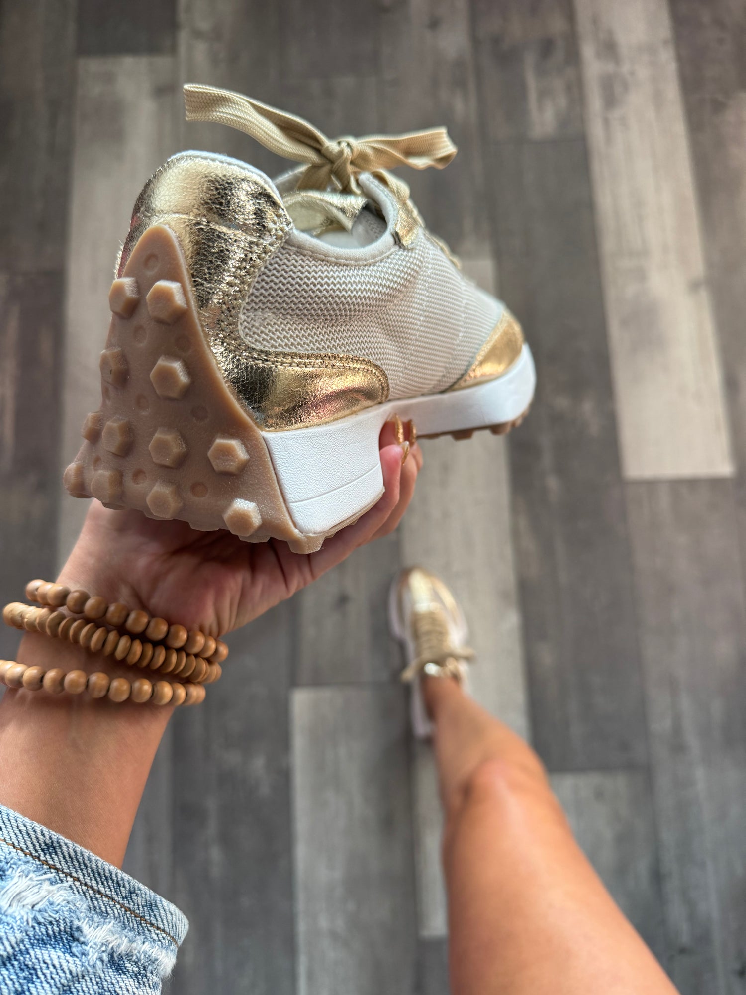 Illustrative example of gold tennis shoes
