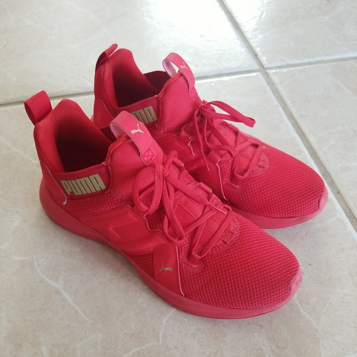 Illustrative example of puma red shoes